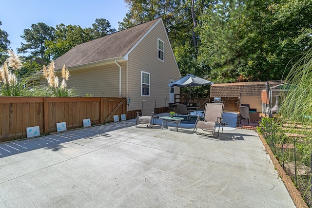 view of patio / terrace with a storage unit