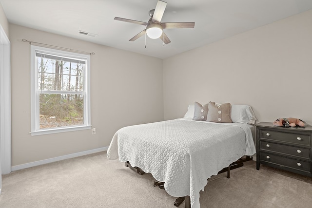 bedroom featuring a ceiling fan, baseboards, visible vents, and carpet flooring