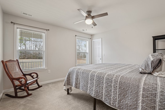 bedroom with baseboards, visible vents, ceiling fan, and carpet flooring