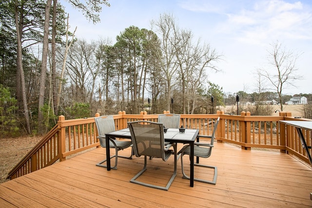 wooden terrace featuring outdoor dining space