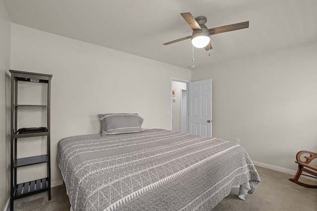 bedroom featuring a ceiling fan, carpet, and baseboards