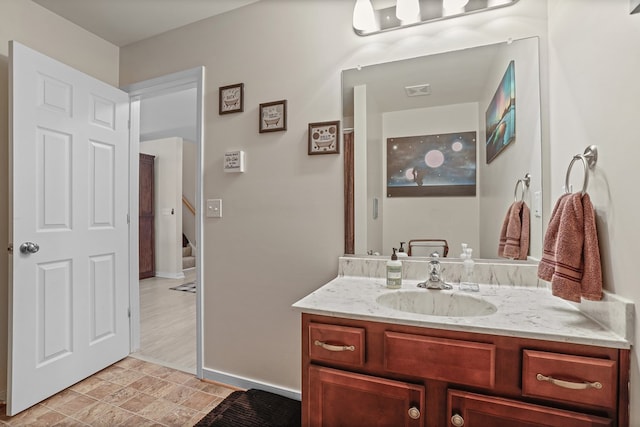 bathroom featuring vanity and baseboards