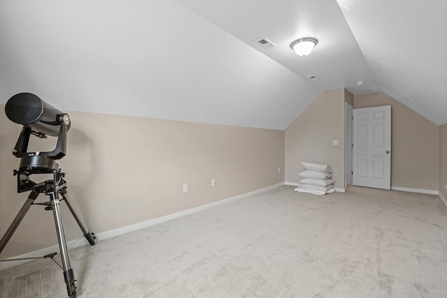 bonus room featuring carpet floors, lofted ceiling, visible vents, and baseboards