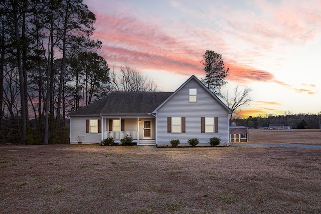 view of front of home featuring a porch and a front yard