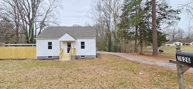 7626 Richmond Rd, Warsaw, VA 22572 - view of front of home with crawl space, roof with shingles, a front yard, and fence