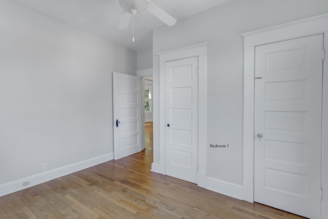 unfurnished bedroom with light wood-type flooring and ceiling fan