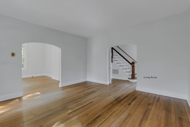 unfurnished room featuring hardwood / wood-style floors