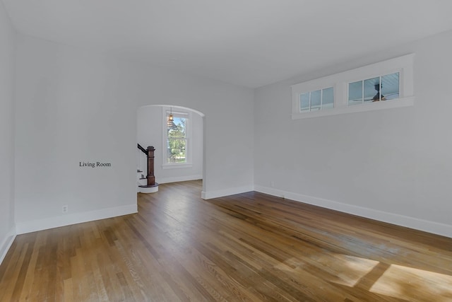 unfurnished room with hardwood / wood-style flooring