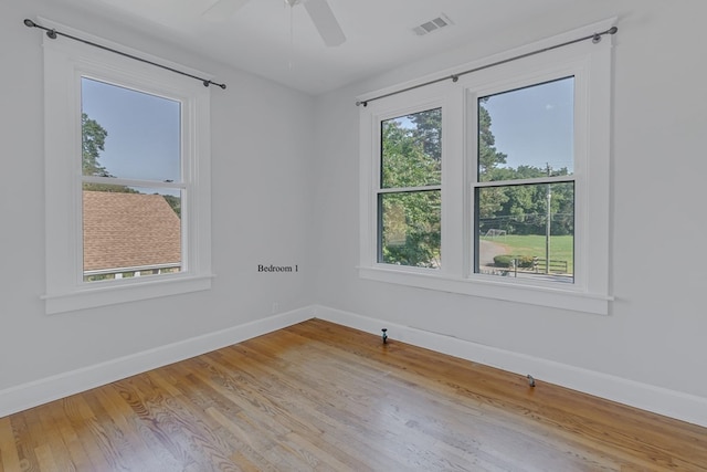 spare room featuring ceiling fan and light wood-type flooring