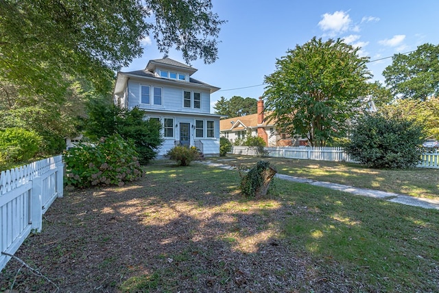 exterior space with a front lawn