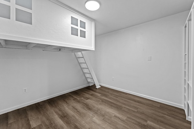 unfurnished room with dark hardwood / wood-style floors