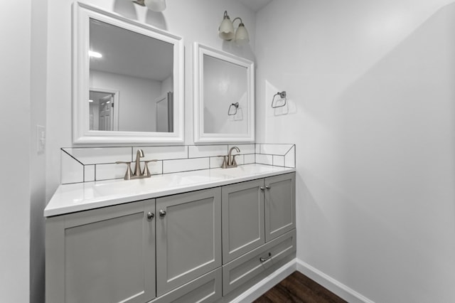 bathroom featuring hardwood / wood-style flooring and vanity