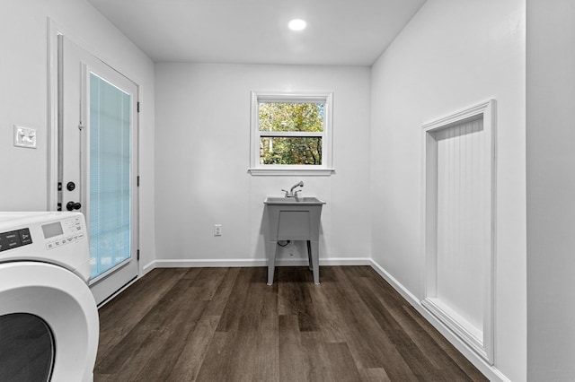 laundry room featuring washer / clothes dryer and dark hardwood / wood-style flooring