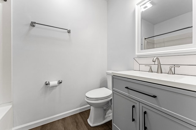 bathroom featuring hardwood / wood-style floors, vanity, and toilet