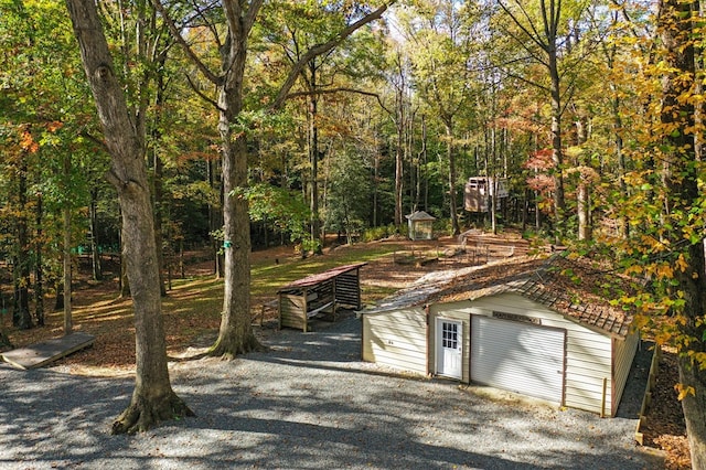 exterior space with an outdoor structure and a garage