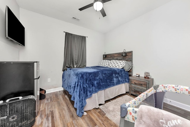 bedroom featuring ceiling fan and hardwood / wood-style floors