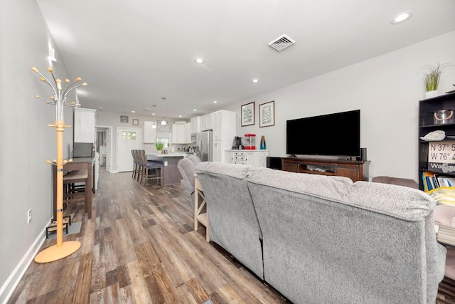 living room with light hardwood / wood-style floors