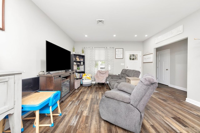 living room featuring dark hardwood / wood-style floors