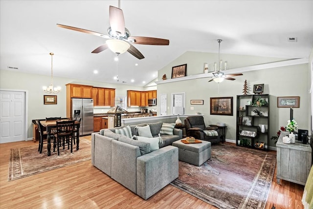 126 Pioneer Trl, Hague, VA 22469 - living area with a ceiling fan, a chandelier, light wood-style floors, recessed lighting, and high vaulted ceiling