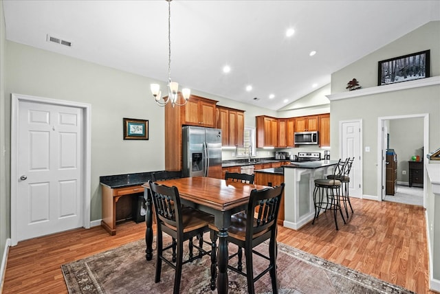 126 Pioneer Trl, Hague, VA 22469 - dining space with light wood-type flooring, a chandelier, recessed lighting, and high vaulted ceiling