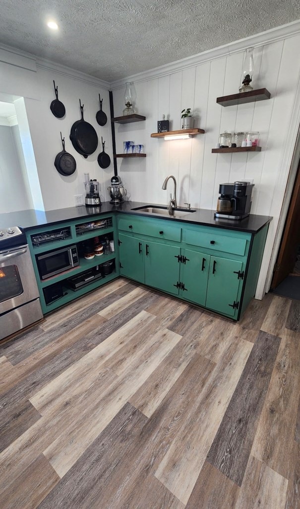 237 Hickory Ln, Reedville, VA 22539 - kitchen featuring open shelves, green cabinets, stainless steel electric range, dark countertops, and a textured ceiling