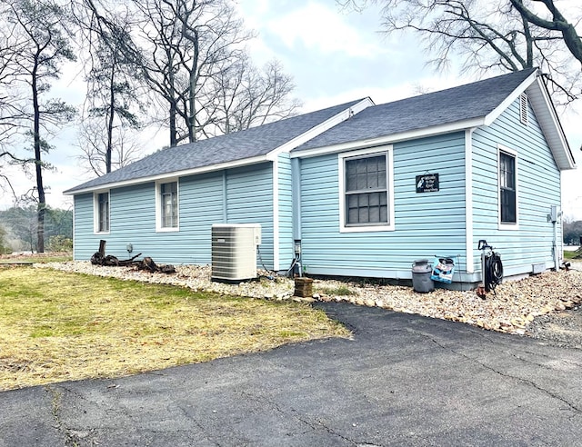 237 Hickory Ln, Reedville, VA 22539 - view of home's exterior featuring roof with shingles and a yard