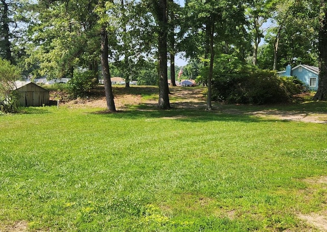 237 Hickory Ln, Reedville, VA 22539 - view of green lawn featuring a storage shed