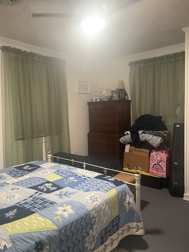 237 Hickory Ln, Reedville, VA 22539 - bedroom with ornamental molding, carpet flooring, and a textured ceiling