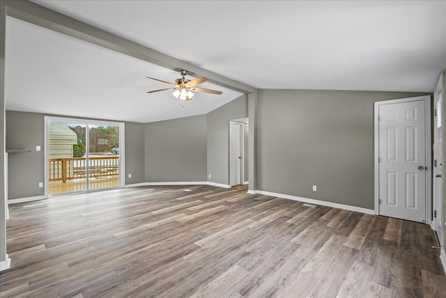 unfurnished living room with hardwood / wood-style flooring, vaulted ceiling with beams, and ceiling fan