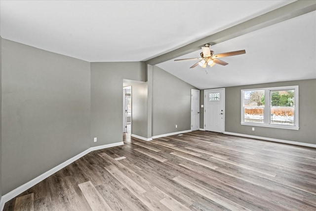 unfurnished living room featuring wood-type flooring, lofted ceiling, and ceiling fan