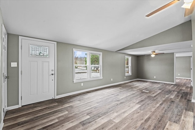 foyer with hardwood / wood-style flooring, lofted ceiling, and ceiling fan