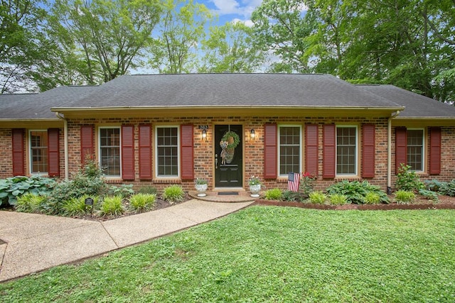 383 Monroe St, Montross, VA 22520 - ranch-style home with brick siding, a front yard, and a shingled roof
