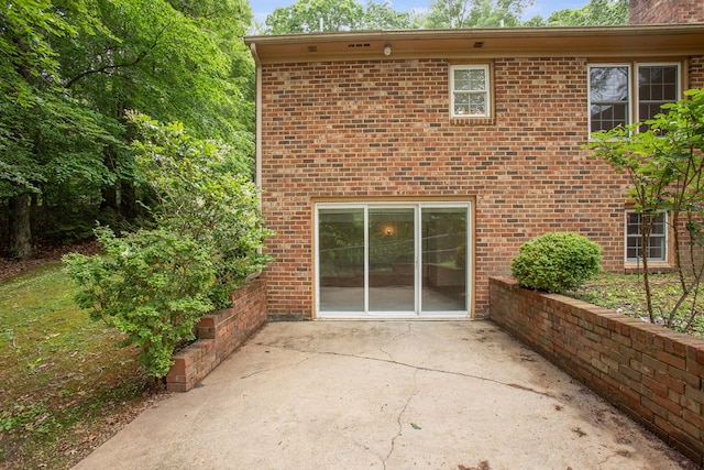 383 Monroe St, Montross, VA 22520 - rear view of house with a patio and brick siding
