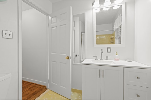 383 Monroe St, Montross, VA 22520 - full bathroom featuring vanity, a shower with curtain, wood finished floors, and baseboards