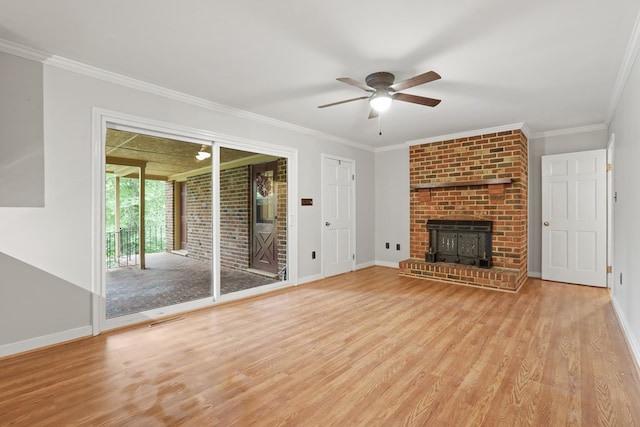 383 Monroe St, Montross, VA 22520 - unfurnished living room featuring a ceiling fan, wood finished floors, baseboards, crown molding, and a brick fireplace