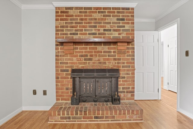 383 Monroe St, Montross, VA 22520 - detailed view of a brick fireplace, ornamental molding, wood finished floors, and baseboards