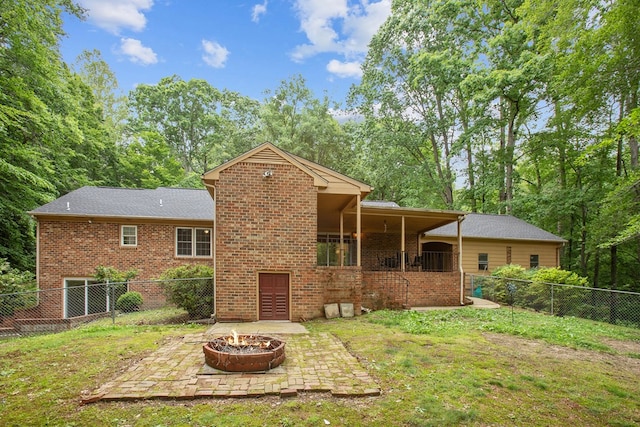 383 Monroe St, Montross, VA 22520 - back of property with a patio area, a fire pit, and brick siding