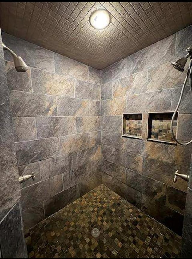 bathroom with tiled shower