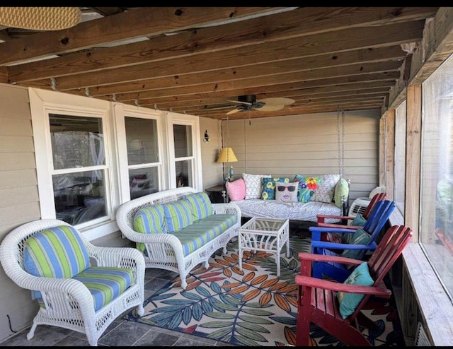 exterior space featuring ceiling fan and outdoor lounge area