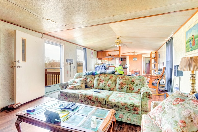 living room featuring ceiling fan, vaulted ceiling, and wood finished floors