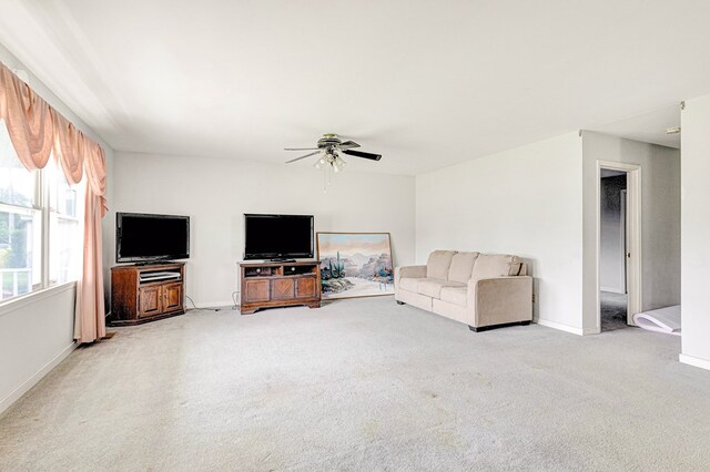 725 Cralle Ave, Tappahannock, VA 22560 - living area featuring light colored carpet and ceiling fan