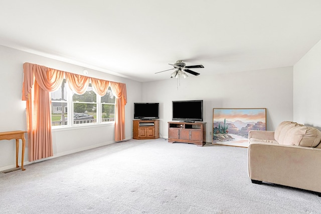 725 Cralle Ave, Tappahannock, VA 22560 - carpeted living room featuring a ceiling fan and baseboards