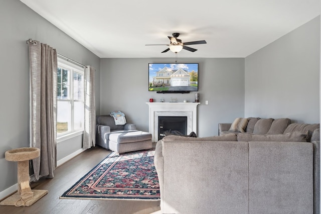 living room featuring hardwood / wood-style floors and ceiling fan