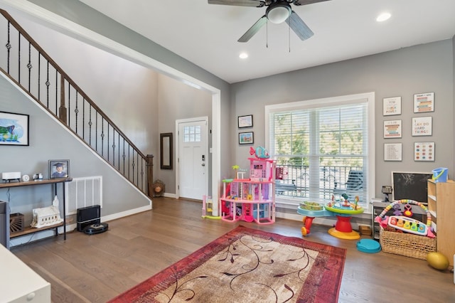 game room with ceiling fan and wood-type flooring