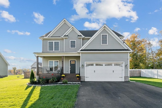 craftsman-style home with a front lawn and a porch