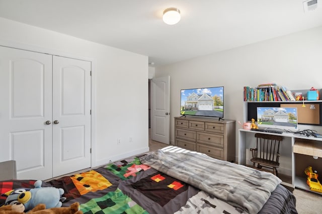 carpeted bedroom with a closet