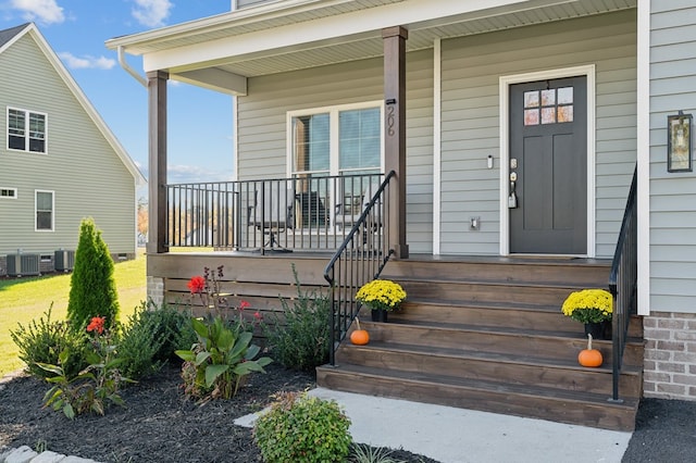 property entrance featuring central AC and covered porch