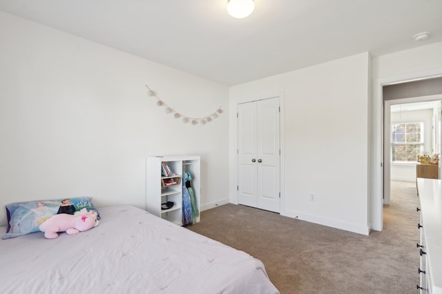 bedroom featuring carpet floors and a closet