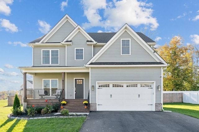 craftsman inspired home with covered porch and a front yard