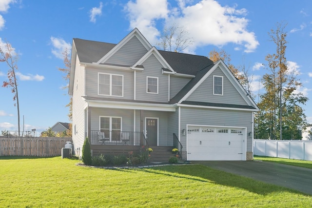 view of front facade with a porch, central AC unit, and a front yard